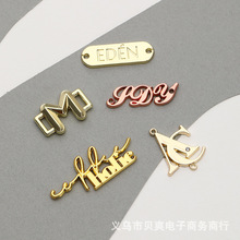 厂家定 制批发压铸锌合金打孔缝线标任意logo形状金属箱包铭牌