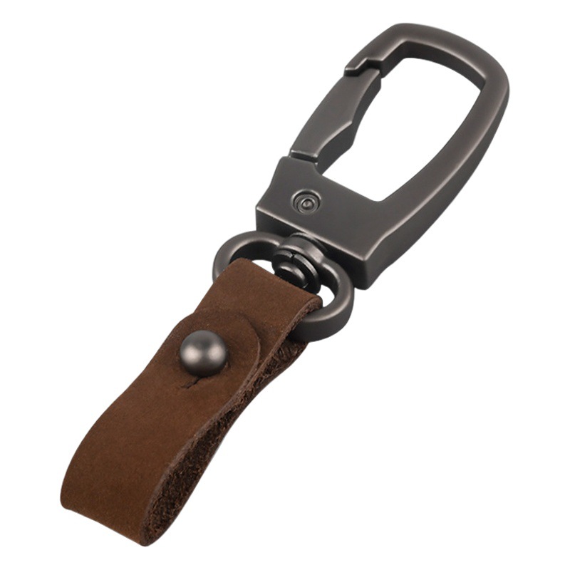 軽くて豪華な本革の自動車のキーホルダーの頭の層のつや消しの牛革の車のキーチェーンの個性のカップルの腰は掛けてペンダントをなくします。