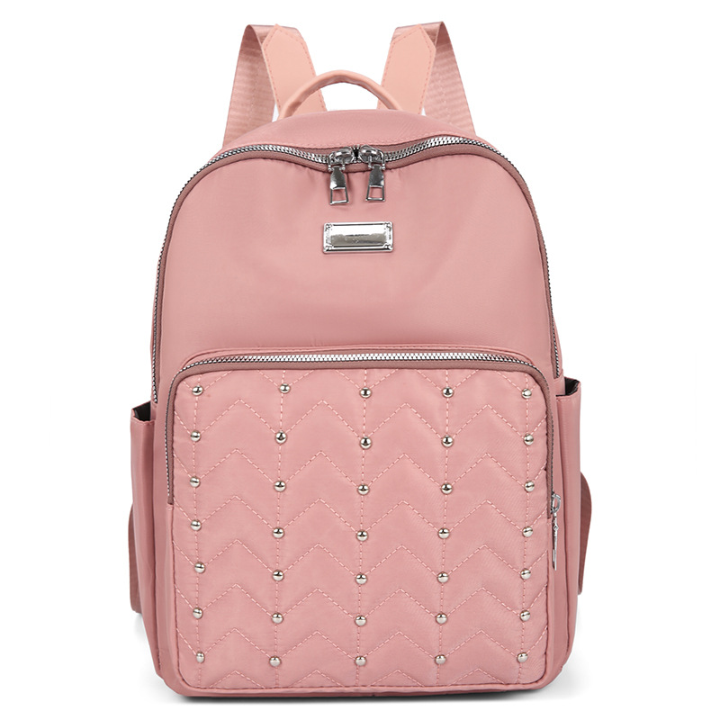 2023 verano nuevo estilo casual damas mochila de tela Oxford moda remache al aire libre mochila de viaje ligera al por mayor