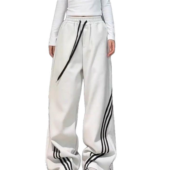 Pantalones deportivos casuales de mujer a rayas negras de la calle alta 2025 nuevo estilo de primavera y otoño sentido del diseño de tres barras pantalones anchos rectos