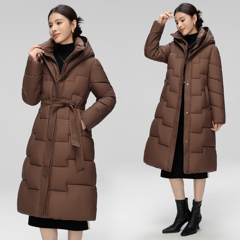 Ropa de algodón mediano y largo para mujeres 2025 cintura delgada encapuchada de invierno nueva moda versátil abrigo de algodón caliente coreano