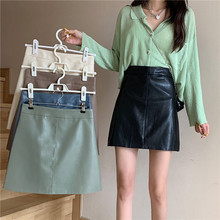 绿色小皮裙女2024秋冬新款显瘦包臂裙pu短裙百搭遮肚子A字半身裙