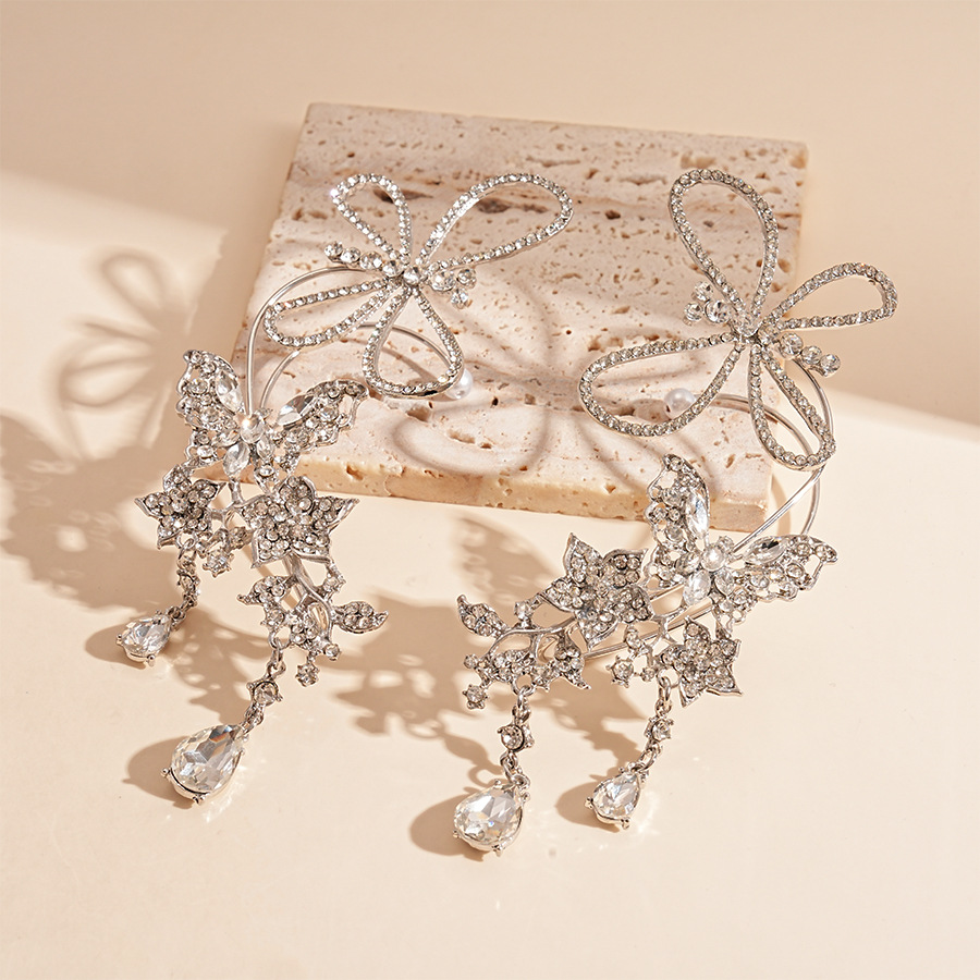 Súper destello y luz, estilo de lujo, mariposa con incrustaciones de diamantes, gotas de agua, orejas huecas, sin perforaciones, personalidad, temperamento de nicho, pendientes de sentido avanzado, mujeres