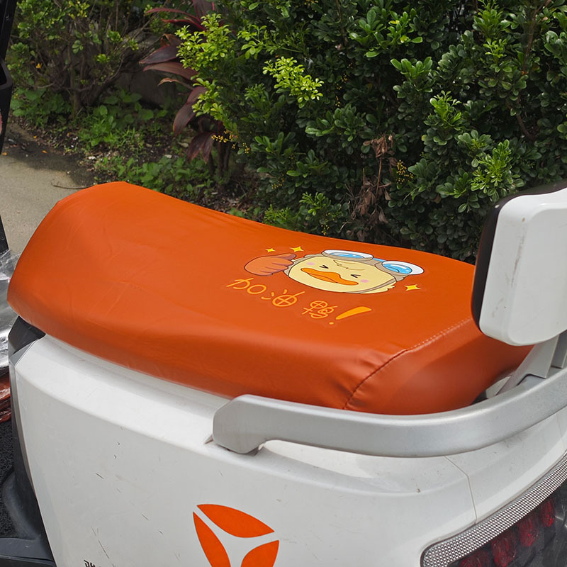 Electric Motorcycle Brown Elastic Leather Cartoon Seat Cushion Sunscreen and Rainproof Yadi Emma Table Bell Thickened Leather Seat Cover