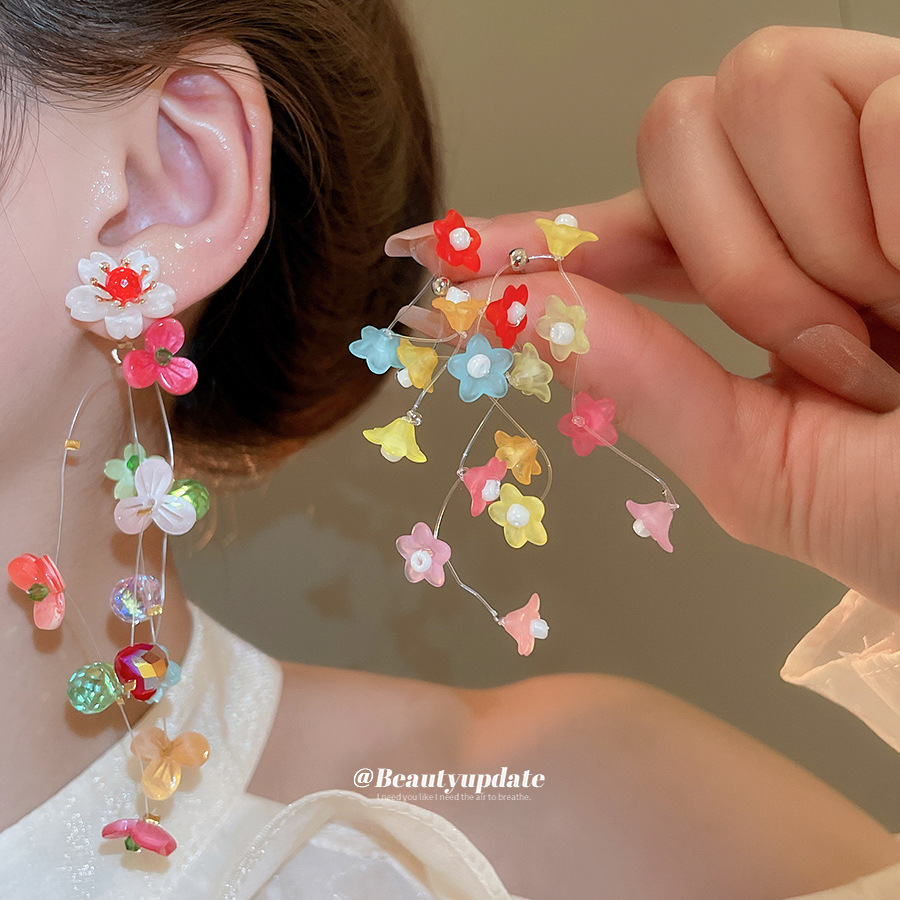 Pendientes de borla de flor de trompeta de color de aguja de plata Pendientes de estilo de vacaciones de verano Pendientes de todo fósforo de moda femenina Sentido de diseño nicho