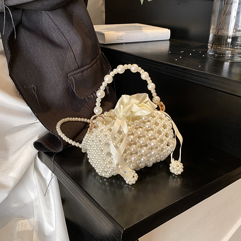 2025 nuevo bolso para niños fresco dulce perla trenzada bolso de hombro para niñas mini bolso de almohada para niños
