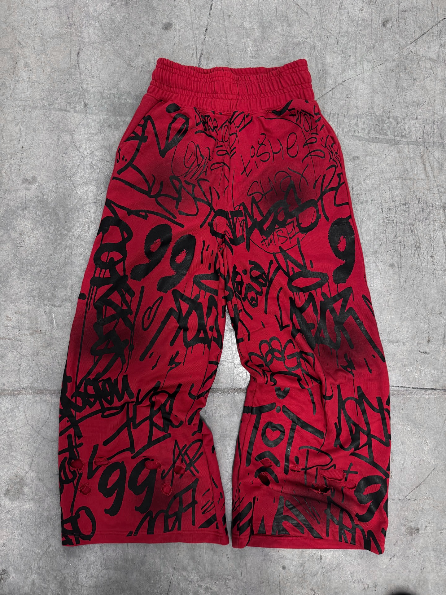 2025 sentido de diseño otoño y invierno Europa y Estados Unidos transfronterizos moda callejera relajada hip hop tendencia nuevos pantalones largos