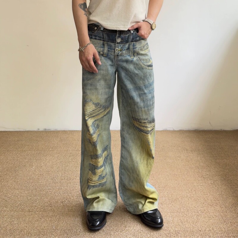 Outcast American-style multi-waistband printed jeans, unisex, with a distressed, gradient, and ripped design, featuring digital prints and a wide-leg, casual fit Outcast American-style multi-waistband printed jeans, unisex, with a distressed, gradient, and ripped design, featuring digital prints and a wide-leg, casual fit
