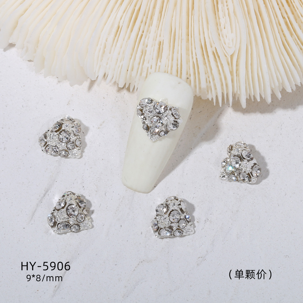 Venta caliente taladro de uñas arco de plata joyería tridimensional flash diamante esmalte de uñas decorativo diamante acabado pieza de uñas traje de joyería