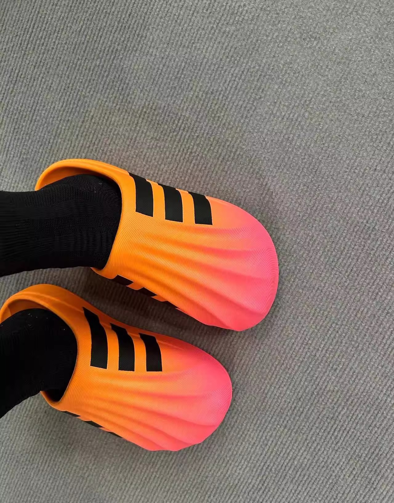 Putian EVA auténtico primavera y otoño nuevo tipo de zapatillas de cabeza de conchas de dopamina para hombres y mujeres zapatillas de agujero de fondo grueso