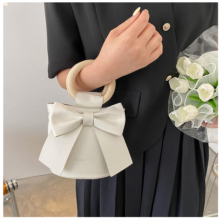455g Weight Synthetic Leather Lining Material Sewing Thread Fashion Element Magnetic Buckle Closure Type Single Shoulder Strap, Double Handle Strap Type Bucket Bag Bags Type Casual Occasion Pu Leather Material Bow Knot Pattern All Seasons Season Women's Gender Elegant Style Bucket Shape Small Size Women's Small Pu Leather Bow Knot Elegant Sewing Thread Bucket Magnetic Buckle Bucket Bag 24