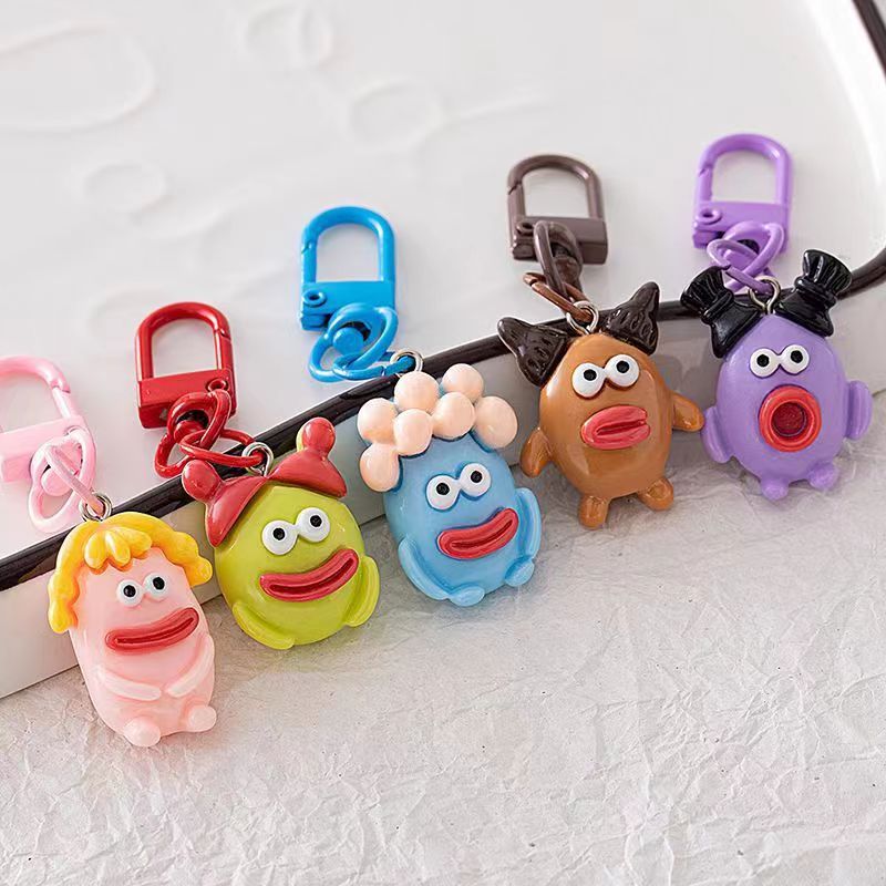 Bonita boca grande extraña llavero salchicha colgante estudiante pequeño libro rojo con accesorios colgante de color para amigos regalos