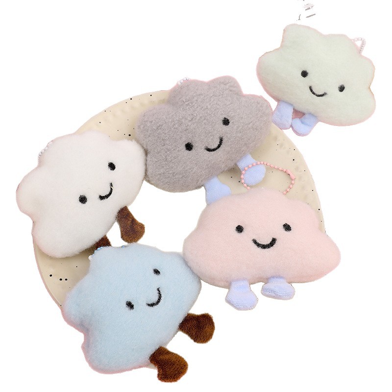 Procesamiento personalizado 2026 nuevo dibujos animados peluche nube mochila decoración colgante muñeca sonriente accesorios muñecas en línea