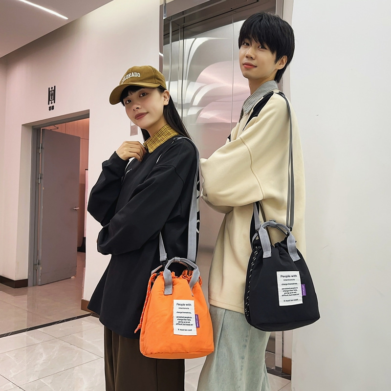 カジュアルでファッショナブルな女性用コインバッグ、カップル用ショルダーバッグ、トレンディな布製ポータブルバケットバッグ、男性用多用途クロスボディバッグ|undefined