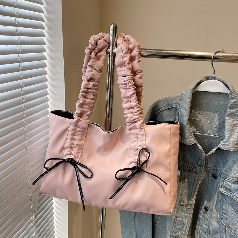 Bolso de arco de la mujer 2025 nueva moda coreana bolso de tela de gran capacidad bolso de mujer de alto valor facial