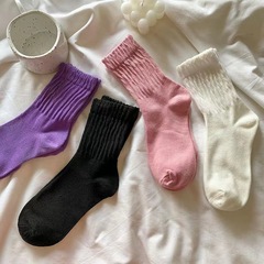 Instagram-worthy, high-fashion women's summer socks: stylish mid-calf socks in classic solid colors—versatile and perfect for a trendy, laid-back look.