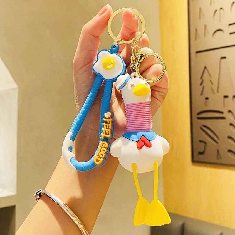 Llavero de cuello telescópico creativo de dibujos animados Divertido colgante de bolsa de descompresión colgante de coche cadena anillo pequeño regalo al por mayor