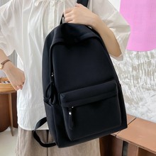 新款简约超轻黑白棋盘格帆布包女大容量双肩背包中小学生书包批发