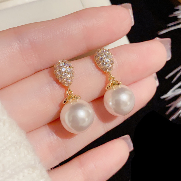 Sophisticated small fashionable elegant earrings drop-shaped from…