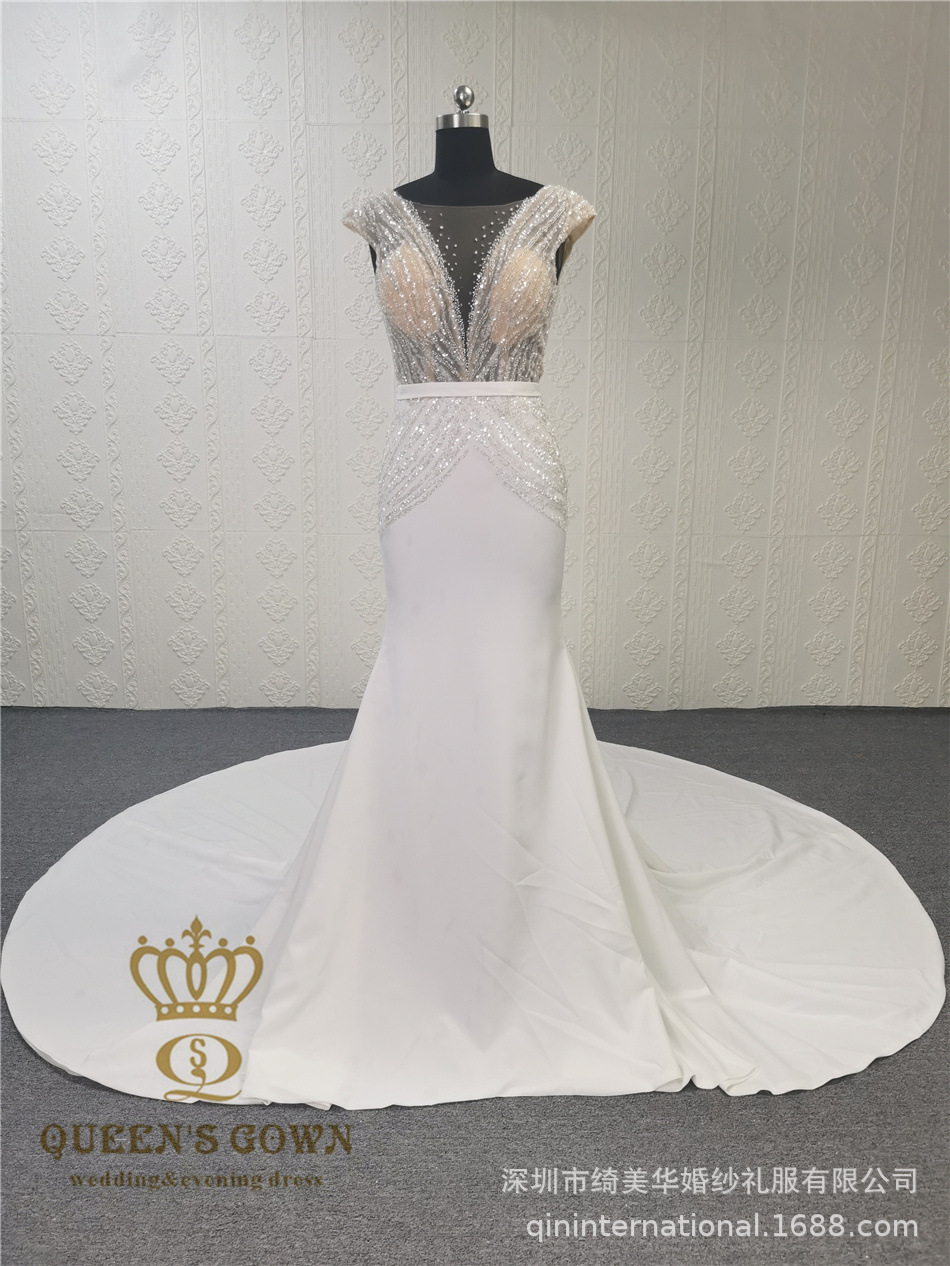 Long elegant beige wedding dress sleevless