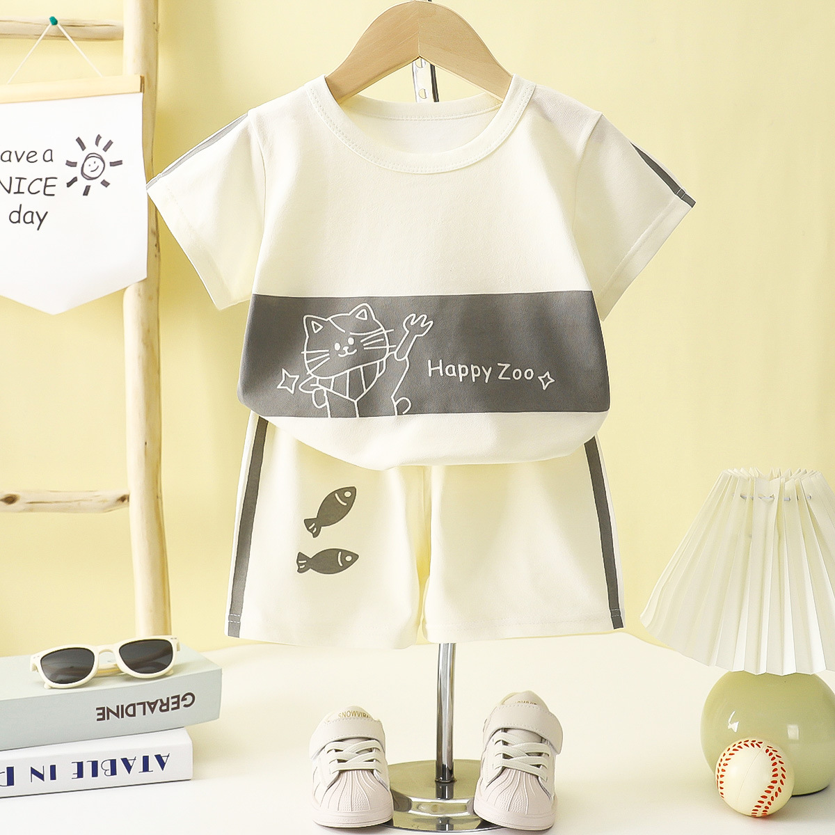 Verano para niños nuevo estilo traje de manga corta camiseta a rayas para niñas y niños ropa de bebé suelta y transpirable al por mayor