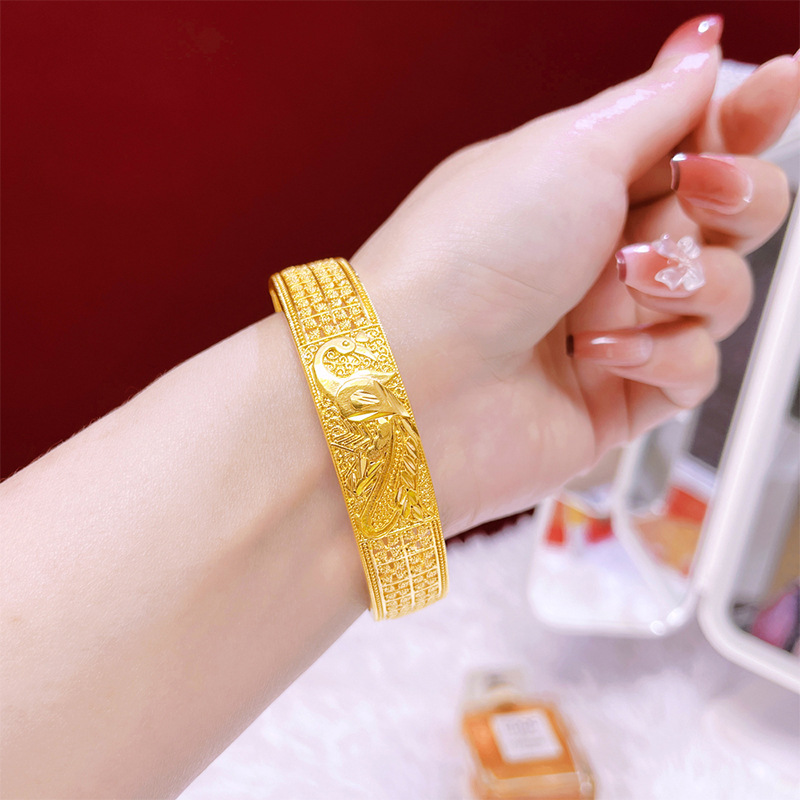 Hueco tallado flor pulsera patrón de pavo real estilo antiguo elegante todo partido pulsera de aleación de cobre hembra Venta caliente suministro directo de fábrica al por mayor