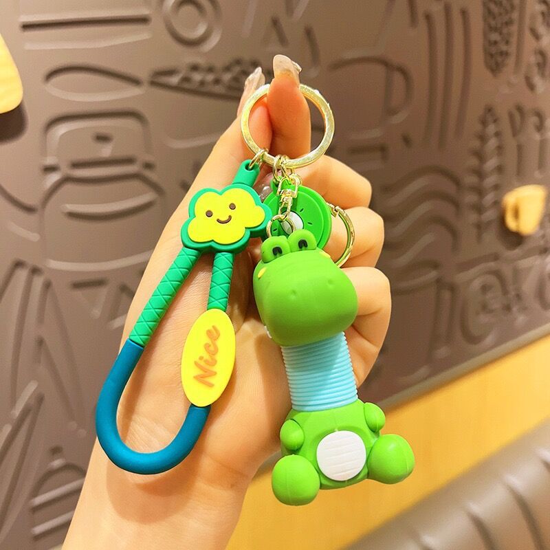 Llavero de cuello telescópico creativo de dibujos animados Divertido colgante de bolsa de descompresión colgante de coche cadena anillo pequeño regalo al por mayor