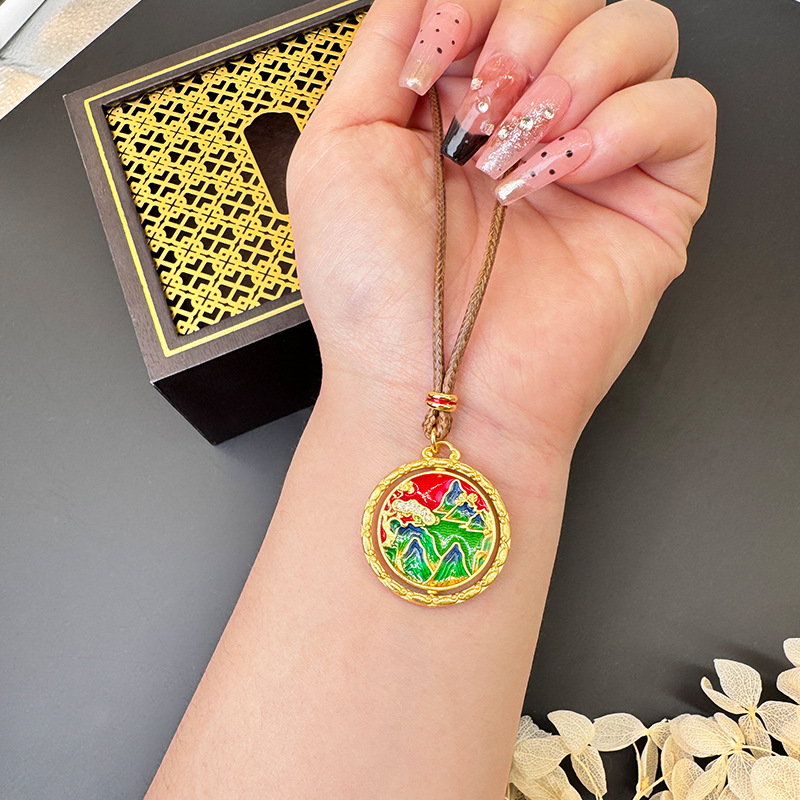 La antigua herencia de China viento verde montaña agua verde nubes auspiciosas puede girar oro de arena vietnamita joyería de latón retro al por mayor