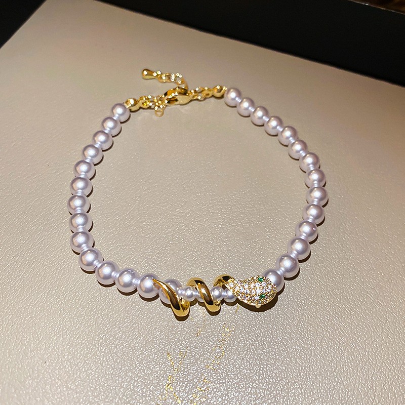 Golden fuchsia bracelet pearl, 5mm
