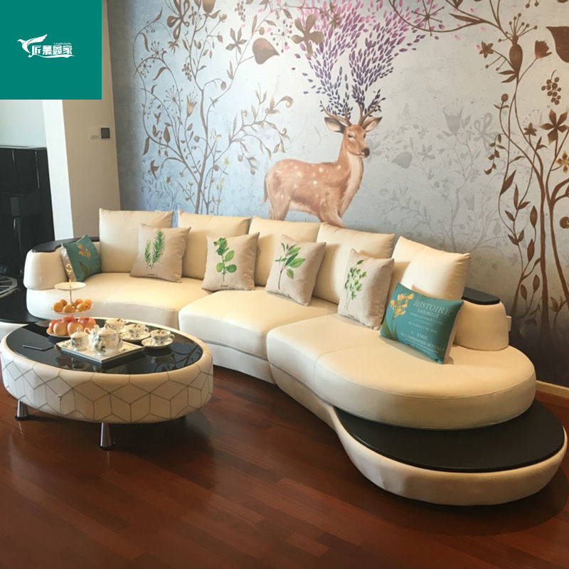 Sofá de cuero curvo creativo, sala de estar de lujo ligero, casa pequeña y mediana, combinación de sofá de cuero moderno, simple y de moda.