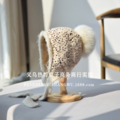 新型のカジュアルなスパンコールは雷鋒帽の女性を連れています。