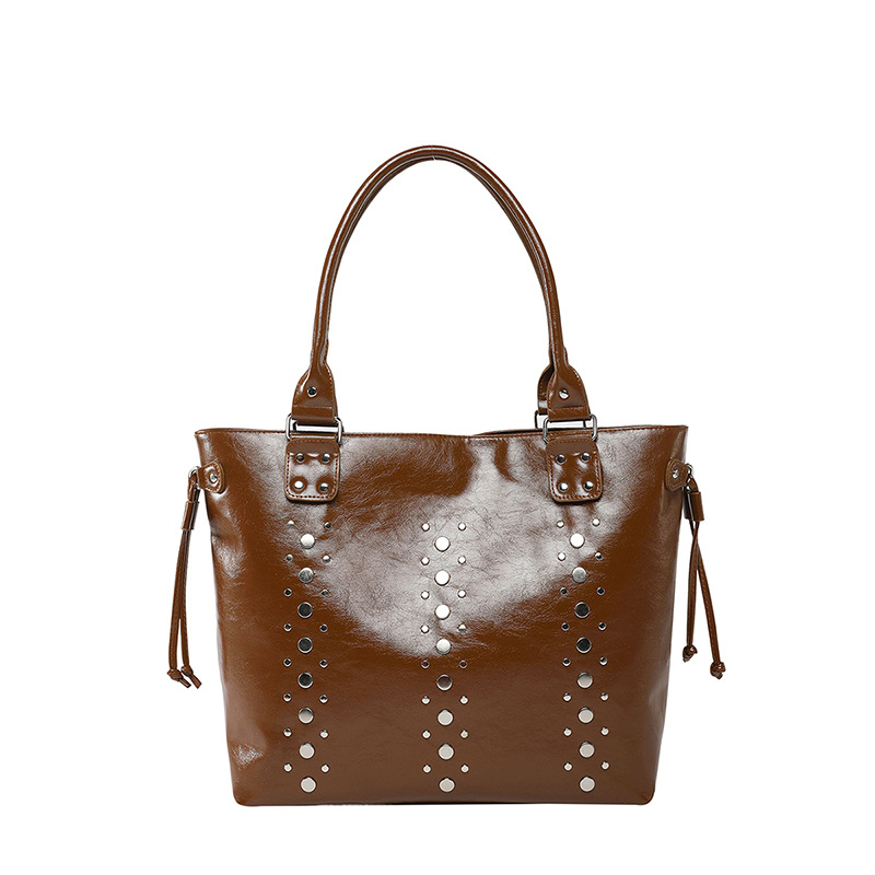 Bolso Tote de textura transfronteriza 2025 verano nuevo bolso femenino personalizado bolso de remache bolso de hombro de gran capacidad de moda