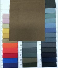 进口涤纶提花点面料提花梭织布料涤纶女装服装布料厂家现货批发