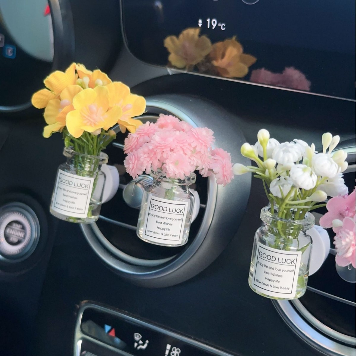 Decoración creativa de salida de aire del automóvil con flores de estrellas pequeñas frescas aire acondicionado botella de perfume de perfumes