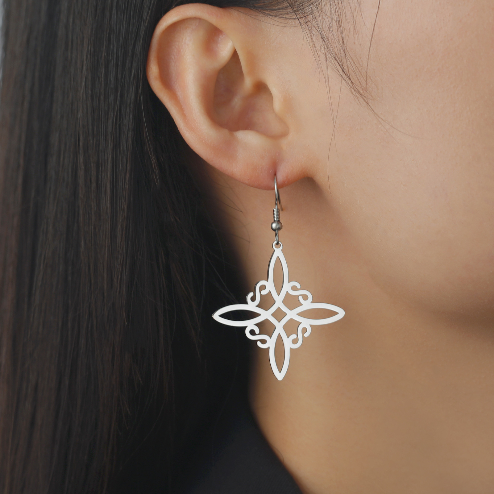 Cross-border e-commerce hot selling cutting titanium steel witch knot S-shaped pendant women's elegant all-match tassel stainless steel earrings