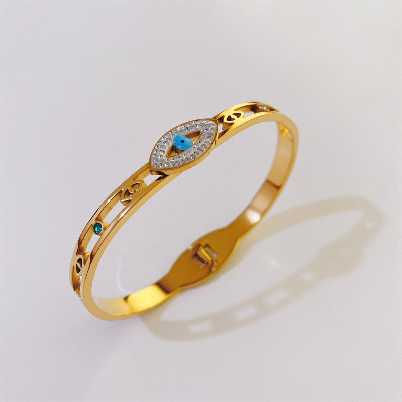 Fashion Hollowed Devil's Eye Shaped Inlaid Zircon Titanium Steel Bangles Wholesale display picture 2