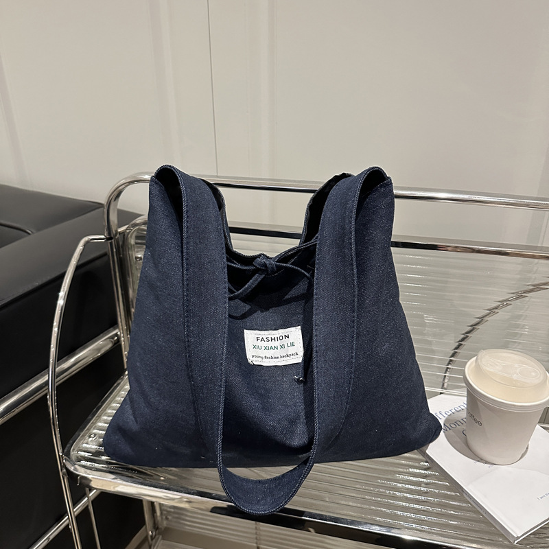 2025 primavera y verano estilo nacional denim tendencia nueva mochila de hombro de gran capacidad mochila de pulsación de la moda