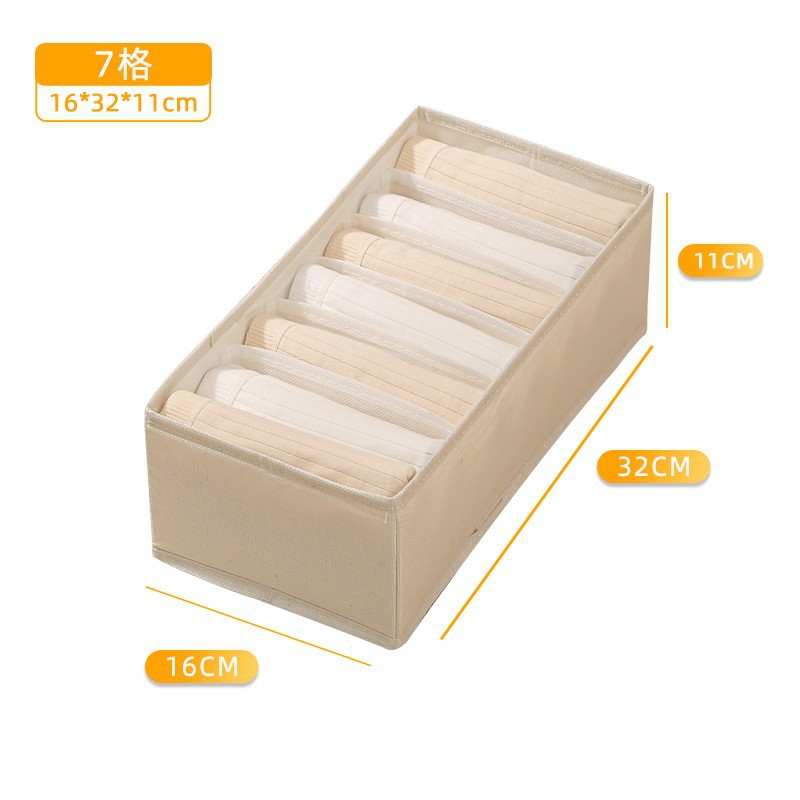 Caja de almacenamiento beige con 7 compartimentos.