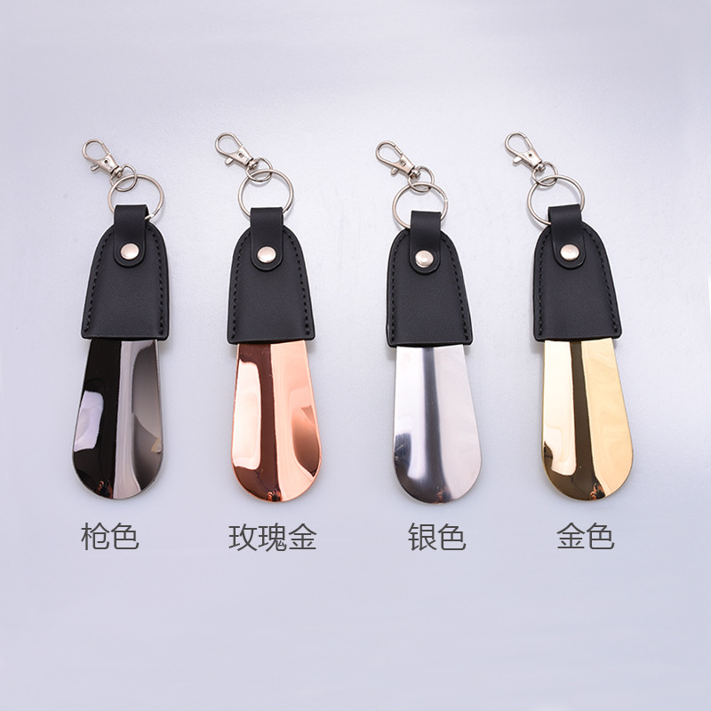 Inventario al por mayor de acero inoxidable llaver de zapato de tirador de cuero funda de zapato portátil de tirador de zapato de coche llave colgante elevador de zapato