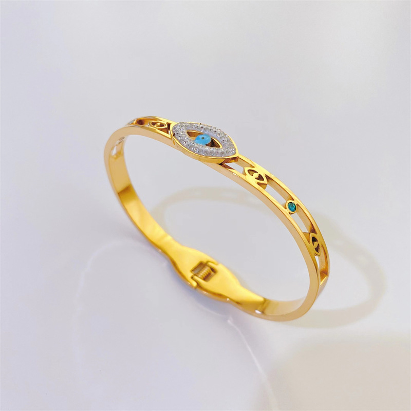 Fashion Hollowed Devil's Eye Shaped Inlaid Zircon Titanium Steel Bangles Wholesale display picture 1