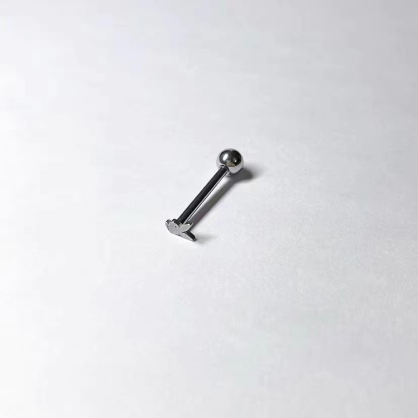 Silver pointed spike labret stud material detail