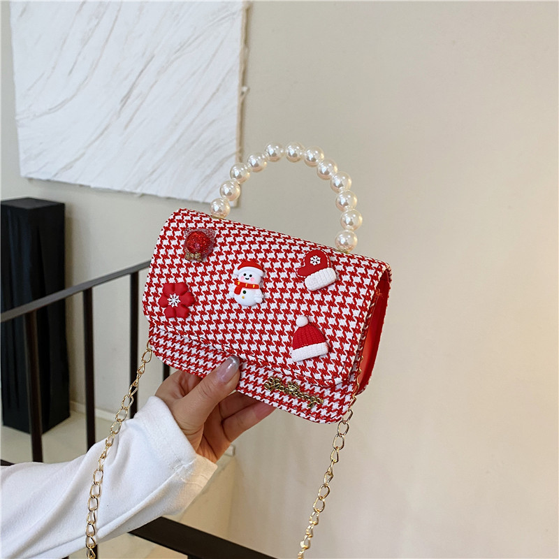 Mini moda para niñas bolso de cambio de perlas 2024 nuevo patrón de moda coreana bolso de ropa infantil