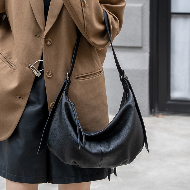 Bolso de mujer de cuero genuino bolso de mujer de gran capacidad 2025 nuevo bolso de albóndigas de cuero de vaca de primera capa con bolso de hombro único de cercanías