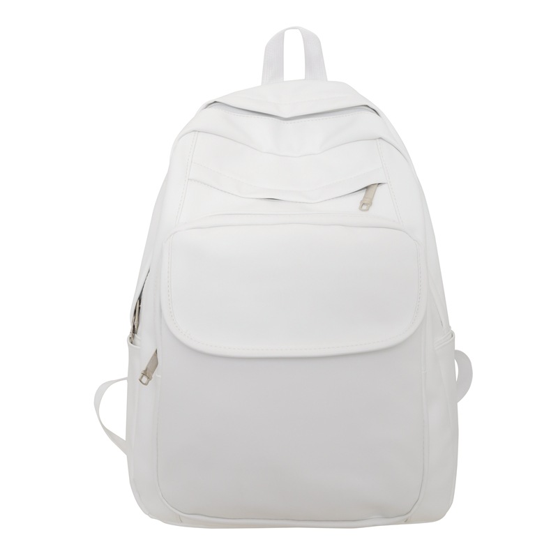 Comercio exterior al por mayor 2023 nueva versión coreana de la mochila de cuero suave para estudiantes de secundaria Mochila de computadora de gran capacidad de color sólido de moda