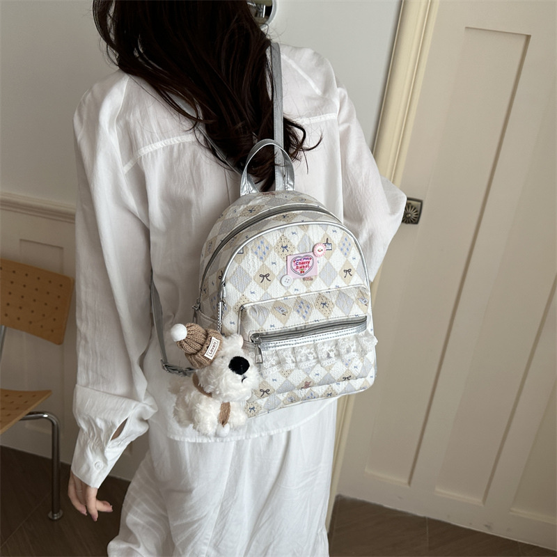 Mochila encantadora de moda coreana de mujer, alto valor de la cara, mochila de viaje diario, mochila universitaria universal.
