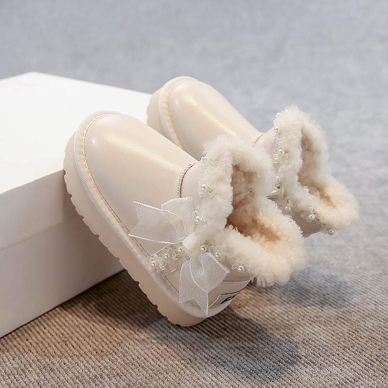 Zapatos de algodón princesa de arco de niñas para niños botas de nieve de lana de invierno 2025 nuevas niñas zapatos de algodón gruesos