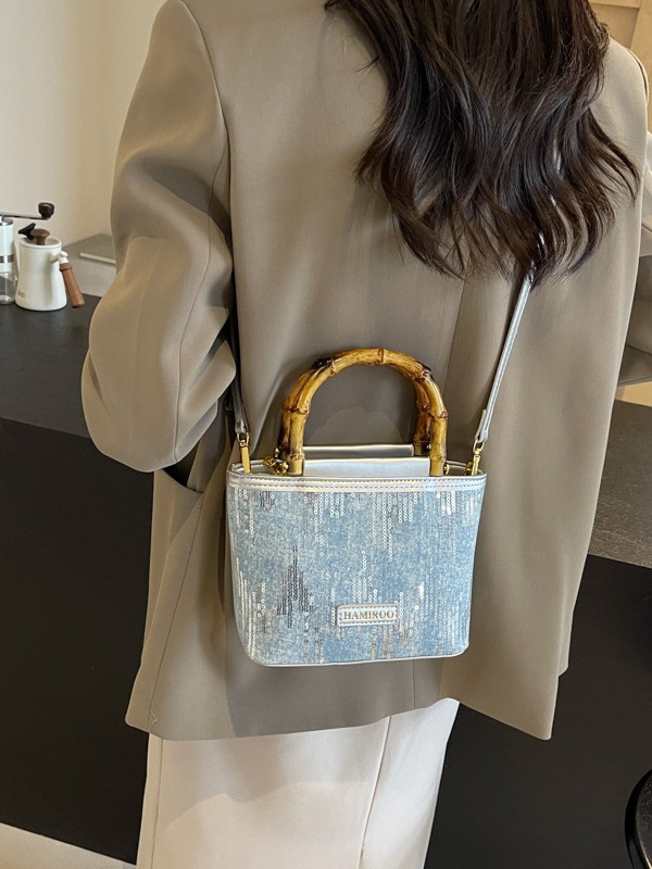 Bolso de mano de bambú para mujeres 2025 nuevo verano bolso de balde de vaquín coreano bolso de hombro mochila de moda