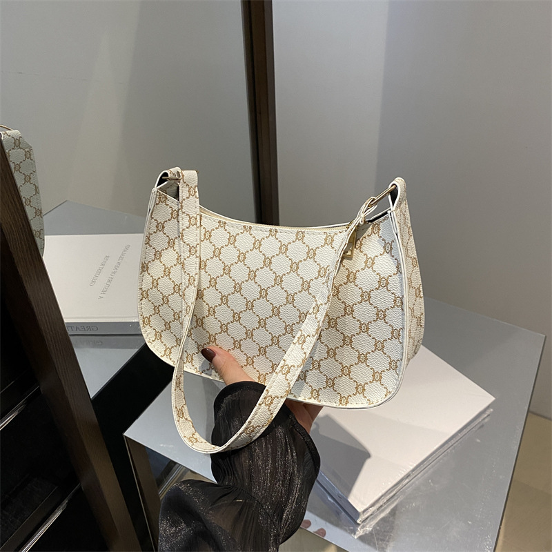 Bolsa de hombro coreana de estilo extranjero con textura de 2024, nueva bolsa de moda de mujer, bolsa de luna media luna, impresión retro, bolsa de tramo pequeño.