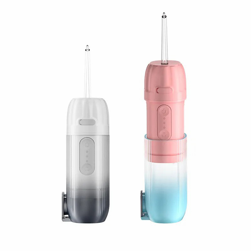 歯を洗う器を持って携帯して歯を洗う器の口腔を洗って水の歯の糸を洗って結石の家庭の贈り物の越境に行きます。|undefined