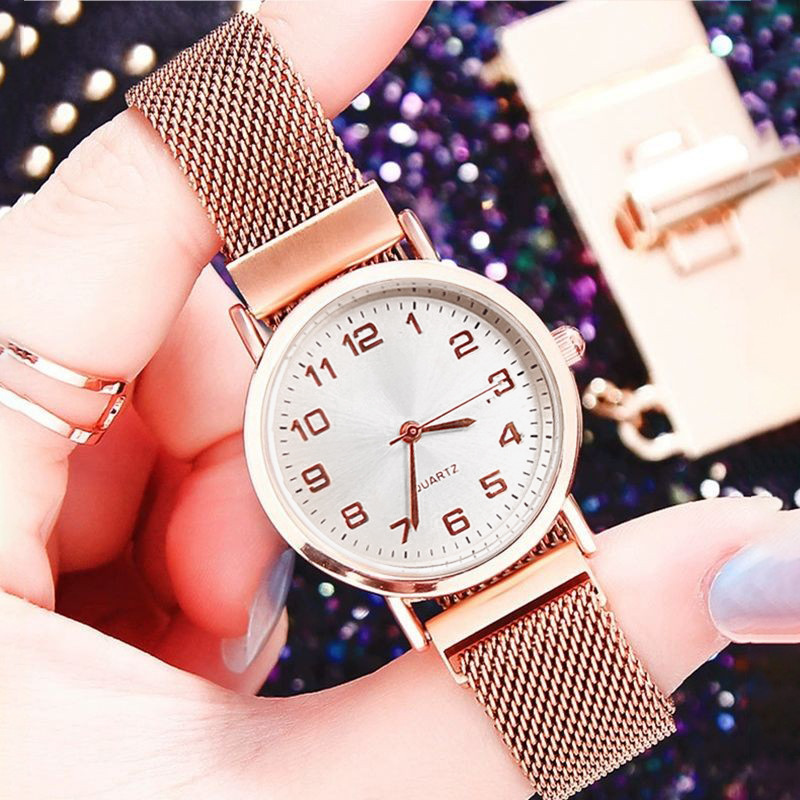 Rose gold belt white surface